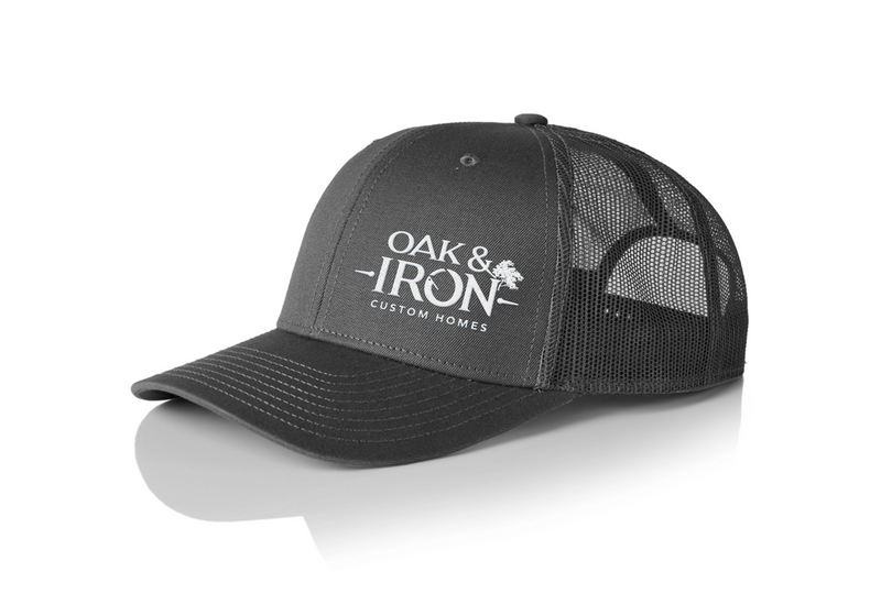 A hat featuring a company logo embroidered slightly offset from the brim, emphasizing CCS’s precise alignment and attention to detail in custom embroidery.
